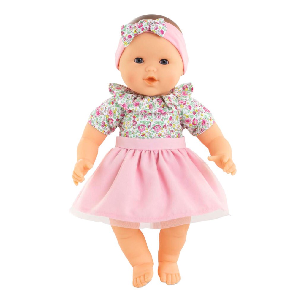 Staande Corolle grote babypop met bloemetjes in roze rok en bijpassende hoofdband