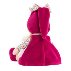 Achteraanzicht van zittende Corolle pop in fuchsia outfit