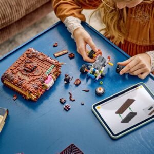 LEGO Monsterboek en kind met tablet en bouwonderdelen